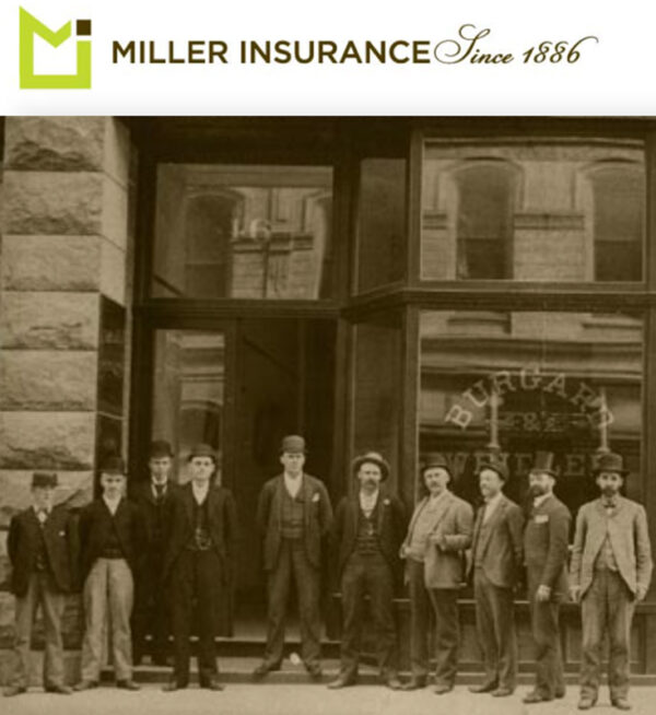 Black and white picture of Miller Insurance employees from 1800s.